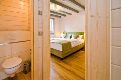 Ein Bett oder Betten in einem Zimmer der Unterkunft Ferienblockhaus Auerhahn & Luchs