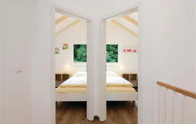 Ein Bett oder Betten in einem Zimmer der Unterkunft Ferienhausdorf Thale