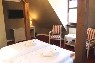 Ein Bett oder Betten in einem Zimmer der Unterkunft Schlosshotel Stecklenberg