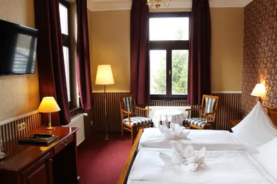 Ein Bett oder Betten in einem Zimmer der Unterkunft Schlosshotel Stecklenberg