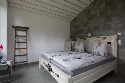 Ein Bett oder Betten in einem Zimmer der Unterkunft Ferienhaus Selke Am Bach
