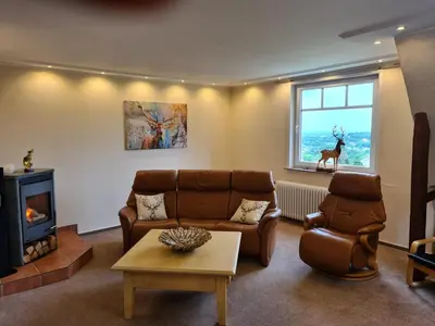 Ein Sitzbereich in der Unterkunft Ferienwohnung Villa am Golfplatz