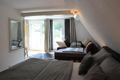 Ein Bett oder Betten in einem Zimmer der Unterkunft Ferienwohnung Villa am Golfplatz