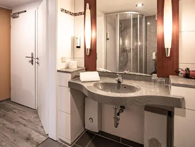 Ein Badezimmer in der Unterkunft Le petit Palais - Hotel/Pension