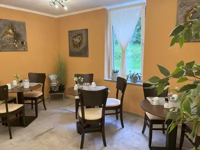 Ein Sitzbereich in der Unterkunft Le petit Palais - Hotel/Pension
