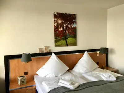 Ein Bett oder Betten in einem Zimmer der Unterkunft Seesicht Appartements am Kranichsee