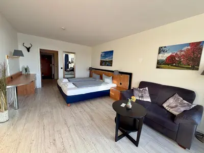 Ein Bett oder Betten in einem Zimmer der Unterkunft Seesicht Appartements am Kranichsee