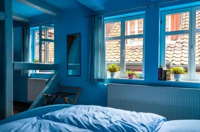 Ein Bett oder Betten in einem Zimmer der Unterkunft Fachwerkhotel garni - Ferienhäuser Vorhof zur Hölle