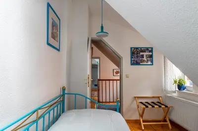 Ein Bett oder Betten in einem Zimmer der Unterkunft Fachwerkhotel garni - Ferienhäuser Vorhof zur Hölle