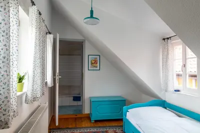 Ein Bett oder Betten in einem Zimmer der Unterkunft Fachwerkhotel garni - Ferienhäuser Vorhof zur Hölle