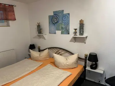 Ein Bett oder Betten in einem Zimmer der Unterkunft Ferienwohnung Hoppelnase mit eigener Sauna