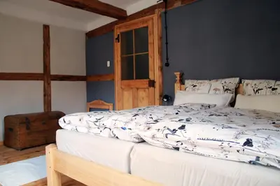 Ein Bett oder Betten in einem Zimmer der Unterkunft Ferienhaus -direkt--Kaisereinsde - traditionelles Lehmbauhaus Parken gratis