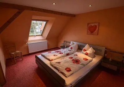 Ein Bett oder Betten in einem Zimmer der Unterkunft Ferienhaus Brockenbäcker