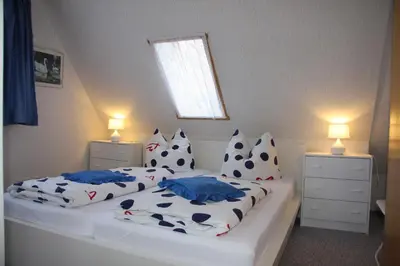 Ein Bett oder Betten in einem Zimmer der Unterkunft Harz-Sonne