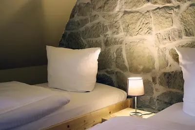 Ein Bett oder Betten in einem Zimmer der Unterkunft Hotel garni Tilia