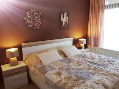 Ein Bett oder Betten in einem Zimmer der Unterkunft Ferienwohnung Mogwitz mit Schwimmbad und Saunanutzung