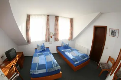 Ein Bett oder Betten in einem Zimmer der Unterkunft Wehrstedter Hof
