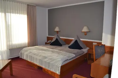 Ein Bett oder Betten in einem Zimmer der Unterkunft Hotel Blocksberg