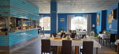 Ein Restaurant oder anderes Speiselokal in der Unterkunft Hotel Blocksberg