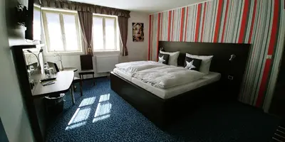 Ein Bett oder Betten in einem Zimmer der Unterkunft Hotel Alte Brennerei