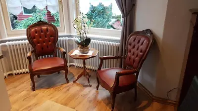 Ein Sitzbereich in der Unterkunft Paul Lincke Residenz