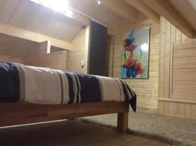 Ein Bett oder Betten in einem Zimmer der Unterkunft Blockhäuser Harzblick