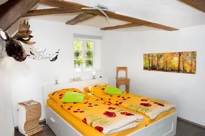 Ein Bett oder Betten in einem Zimmer der Unterkunft Ferienwohnung Goslar Runenhaus