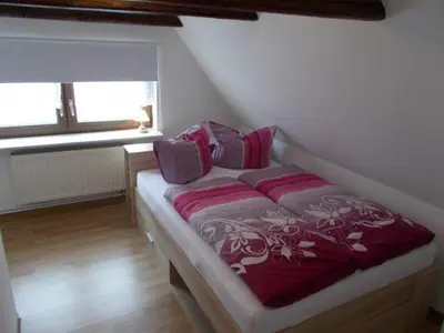 Ein Bett oder Betten in einem Zimmer der Unterkunft Janos Ferienwohnung 2