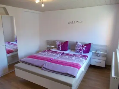Ein Bett oder Betten in einem Zimmer der Unterkunft Janos Ferienwohnung