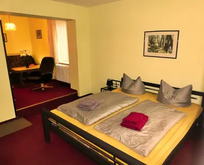Ein Bett oder Betten in einem Zimmer der Unterkunft Pension Haus Rodenstein