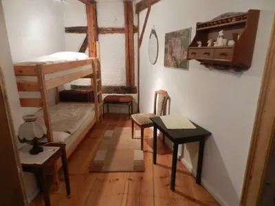 Ein Bett oder Betten in einem Zimmer der Unterkunft Ferienwohnung Kutscherhaus