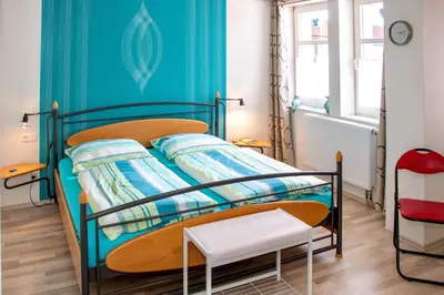 Ein Bett oder Betten in einem Zimmer der Unterkunft Ferienwohnung Margarete