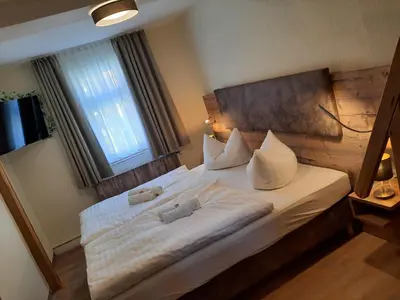 Ein Bett oder Betten in einem Zimmer der Unterkunft Gasthaus Brockenhėxe mit Restaurant & Café