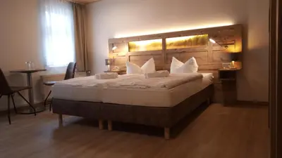 Ein Bett oder Betten in einem Zimmer der Unterkunft Gasthaus Brockenhėxe mit Restaurant & Café