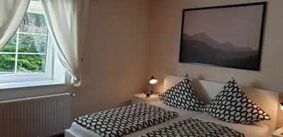 Ein Bett oder Betten in einem Zimmer der Unterkunft Hotel Garni Haus Sonneneck