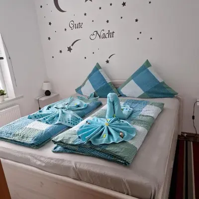 Ein Bett oder Betten in einem Zimmer der Unterkunft Zur Alten Oberförsterei