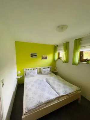 Ein Bett oder Betten in einem Zimmer der Unterkunft FEWO Brockenblick