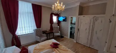 Ein Bett oder Betten in einem Zimmer der Unterkunft Stadtparkhotel Alexandra
