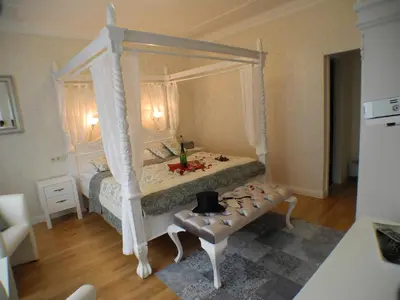 Ein Bett oder Betten in einem Zimmer der Unterkunft Stadtparkhotel Alexandra