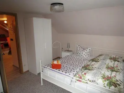 Ein Bett oder Betten in einem Zimmer der Unterkunft Haus Kummeleck, Wohnung 2