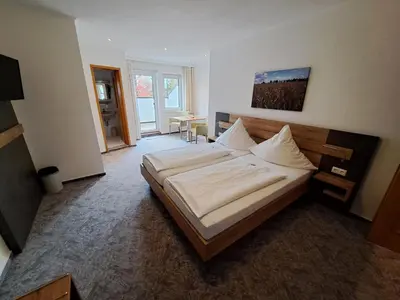 Ein Bett oder Betten in einem Zimmer der Unterkunft Hotel Ingeburg