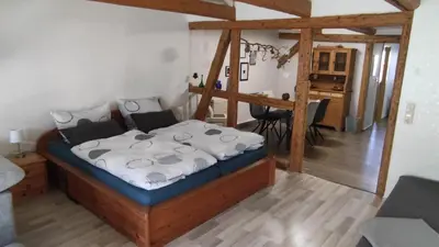 Ein Bett oder Betten in einem Zimmer der Unterkunft FEWO am Wetzstein