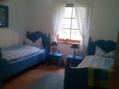 Ein Bett oder Betten in einem Zimmer der Unterkunft Waldhäuschen