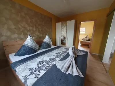 Ein Bett oder Betten in einem Zimmer der Unterkunft Ferienwohnung-Thale-Ritter