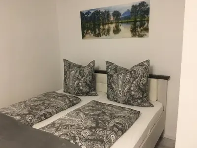 Ein Bett oder Betten in einem Zimmer der Unterkunft Ferienwohnung Univers