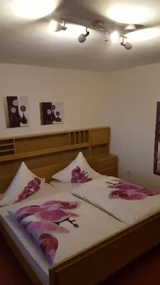 Ein Bett oder Betten in einem Zimmer der Unterkunft Hotel Pension Fernblick