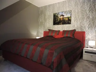 Ein Bett oder Betten in einem Zimmer der Unterkunft Ferienwohnungen Am Burgberg
