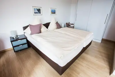 Ein Bett oder Betten in einem Zimmer der Unterkunft Ferienwohnanlage Prinzenhof
