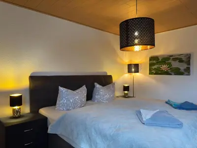 Ein Bett oder Betten in einem Zimmer der Unterkunft Ferienhaus mit Kamin in Thale-Friedrichsbrunn