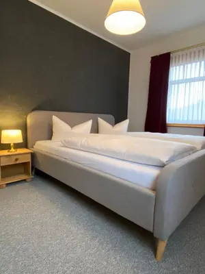 Ein Bett oder Betten in einem Zimmer der Unterkunft Bergcafé Mendorf